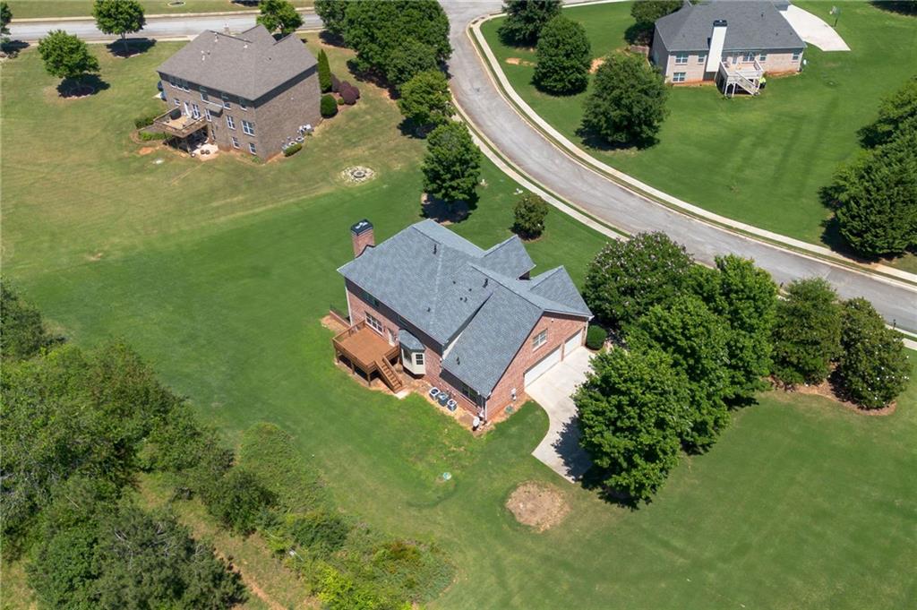 Aerial view of the home and its expansive lawn