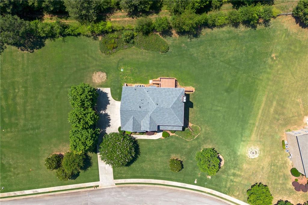 Aerial view of the home and surrounding lawn