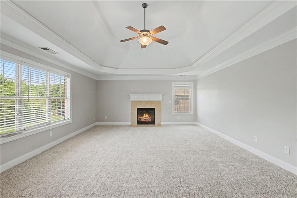 Spacious suite with tray ceiling and fireplace